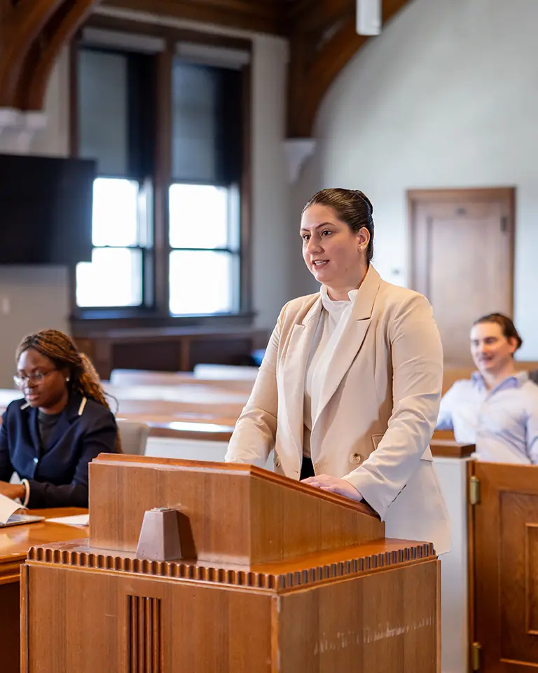 law student at podium speaking