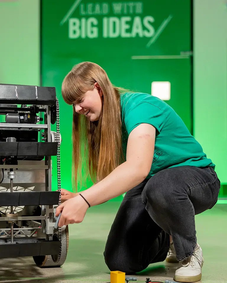 woman working on robot