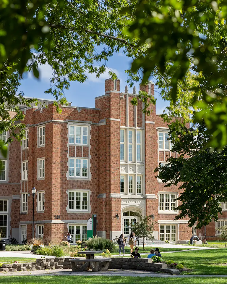UND Education building stands tall with students walking in the quad