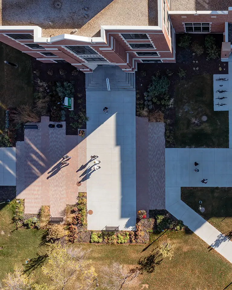 A view from the sky over students walking on campus paths.