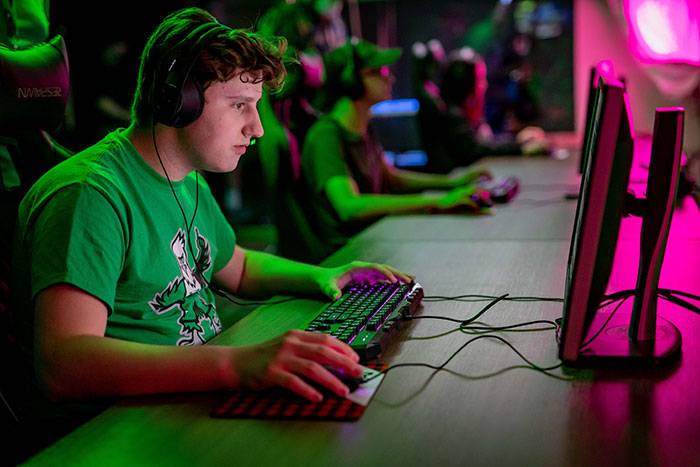 student playing esports on computer