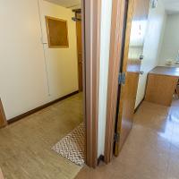 Door open to bedroom and bathroom suite area