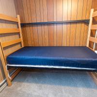 560 Carleton Court twin XL bed on bedframe