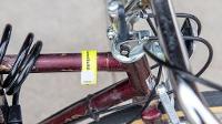 a property tag attached to a bike
