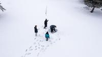 Atmospheric science students in snow 
