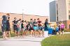 Students gather in Wilkerson Complex Quad outside of the Landing Zone for a game of Slip 'N Slide Kickball