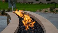 An outdoor gas fireplace