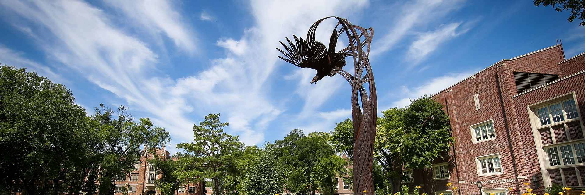 soaring eagle statue with blue sky behind it