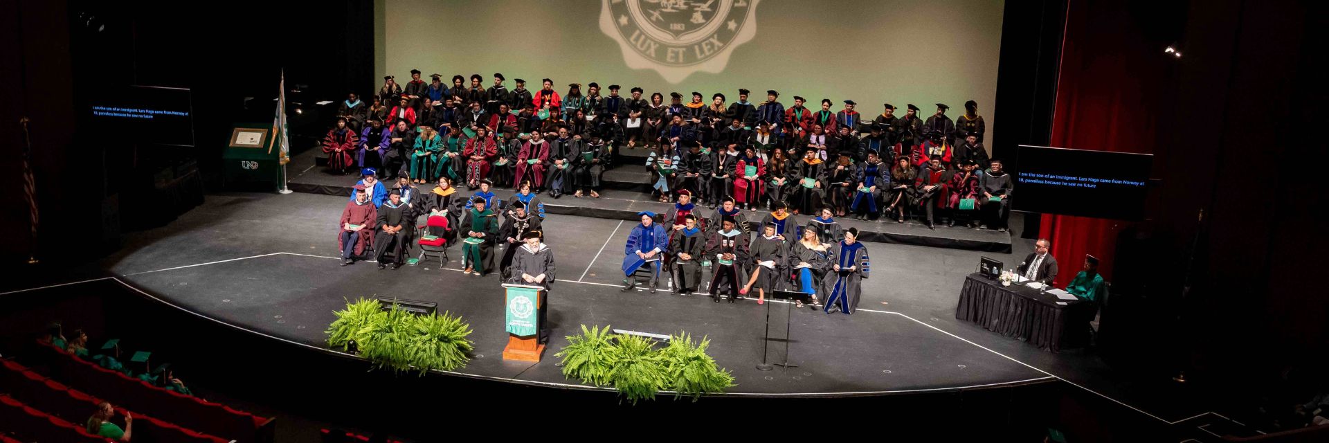 UND faculty on stage