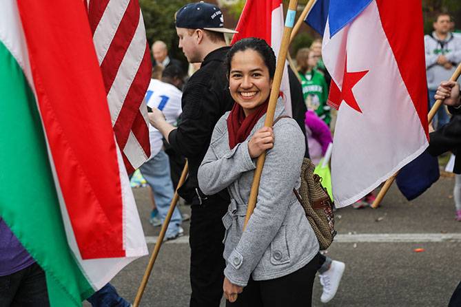 und student participating in parade
