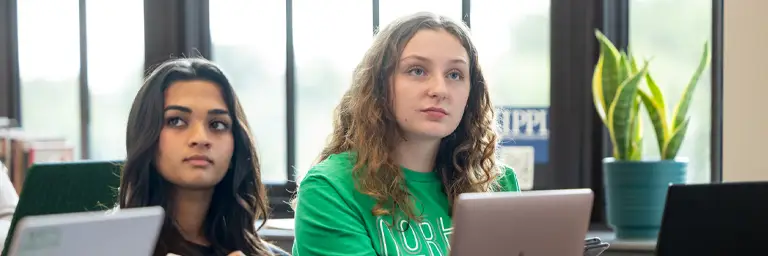 two students sitting in merrifield hall 