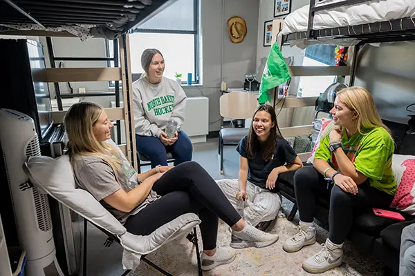 students relaxing in residence hall