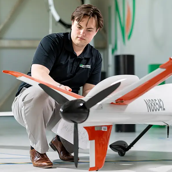 Greyson Orne working on unmanned drone