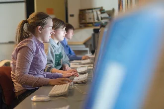 UND students working on computers in a computer lab.