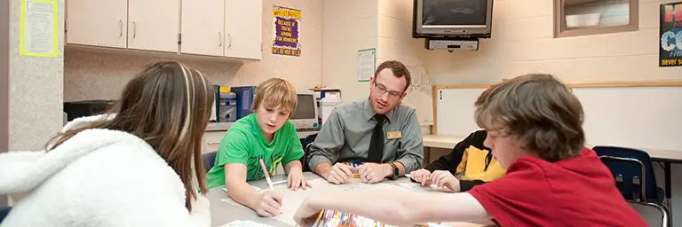 Early childhood education students interacting with children at UND