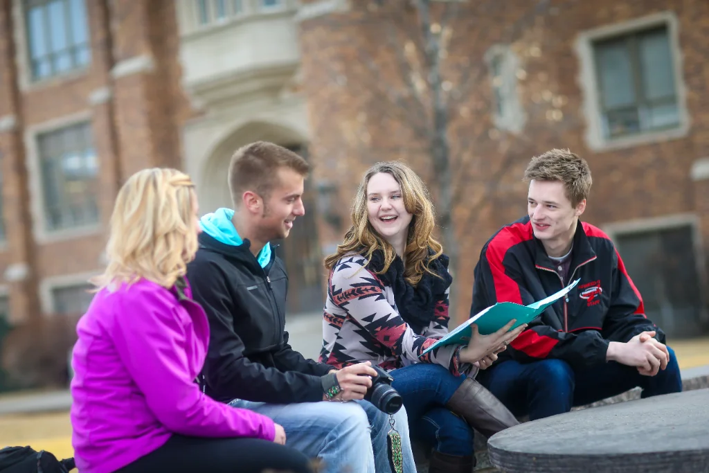 Group of communication students having a discussion.