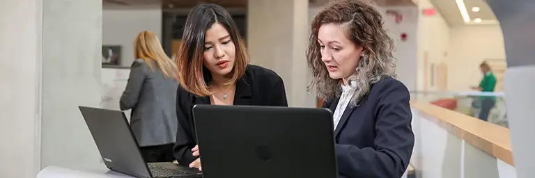 Two MPA students discussing careers