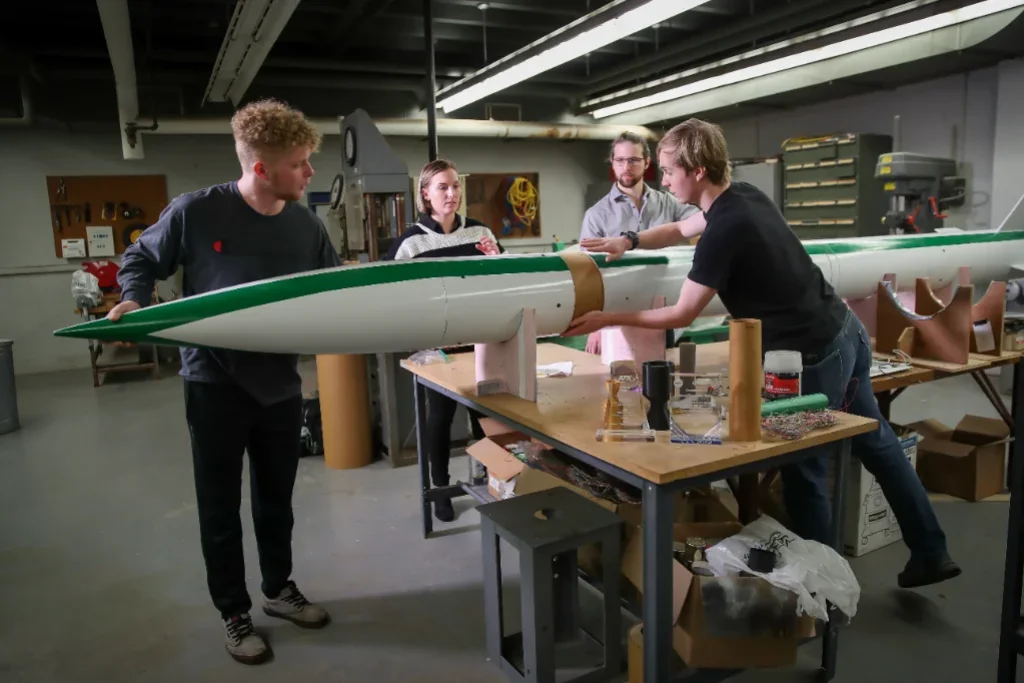 group of students with model rocket