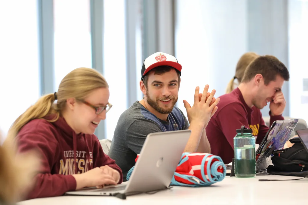 Cyber security students having a discussion during a lecture.