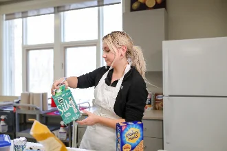 A nutrition student examining the nutritional values.