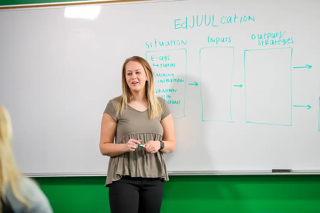 A student presenting in a public health class