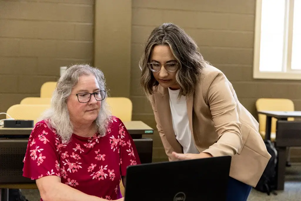 Criminal justice professor and student engaged in discussion