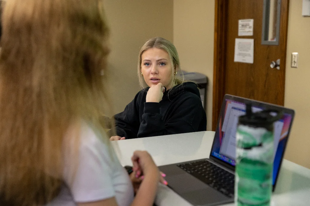 A female criminal justice student in a meetin