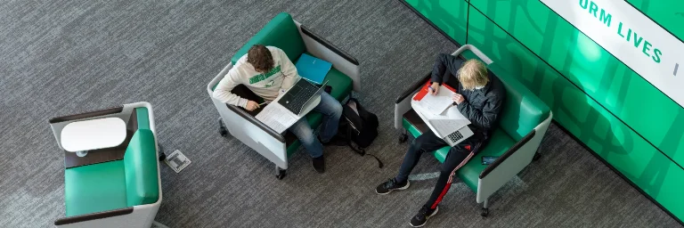 An MBA student and an accounting student studying in the campus library for their next exam