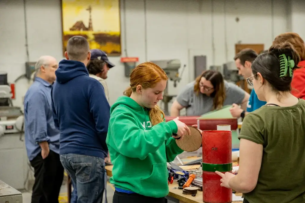 students in an aerospace engineering class practicing aircraft construction