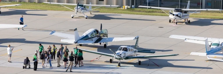 Students and planes on the airport apron