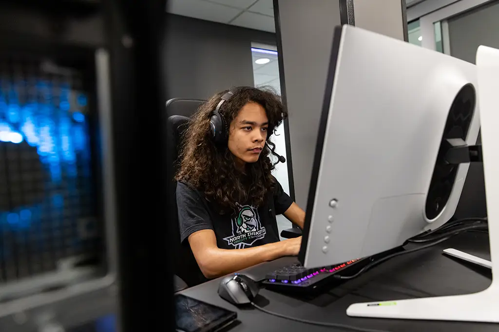 A UND student immersed in a gaming session