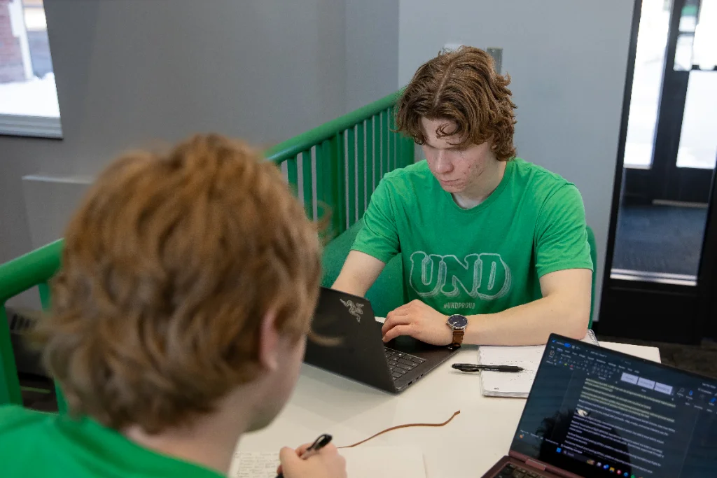UND students taking notes from the online lessons