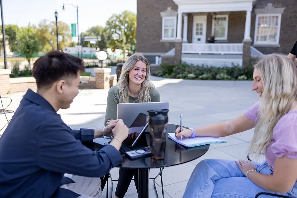 Public administration students taking a collaborative learning approach in campus