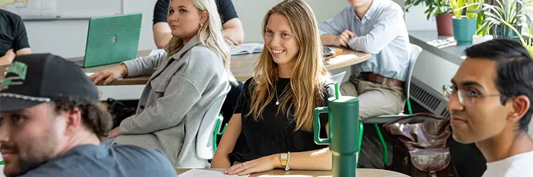 A class of Public Administration students paying close attention during a lecture.