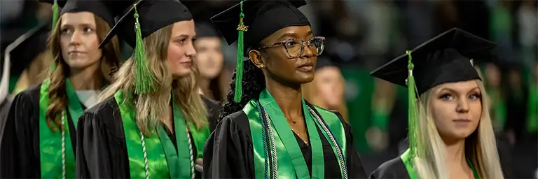 Graduates in caps and gowns mark the final milestone in their engineering school timeline. The image captures the sense of accomplishment and pride after completing a rigorous multi-year degree program