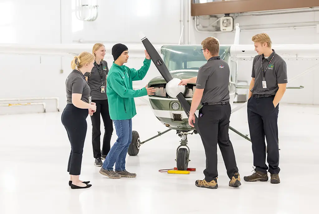 aviation students studying aircraft