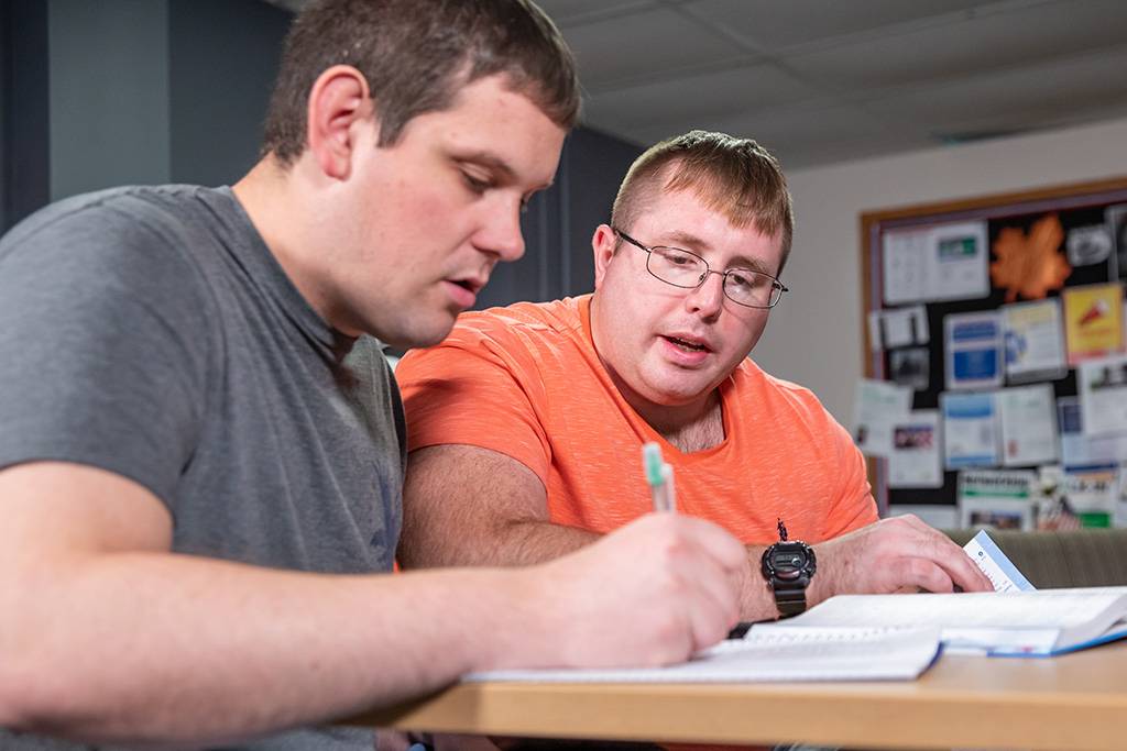 Colin tutoring another student