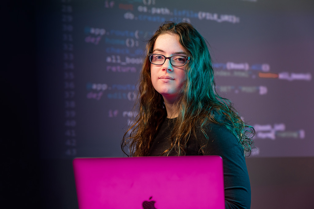 Julia Dewhurst with web code behind her