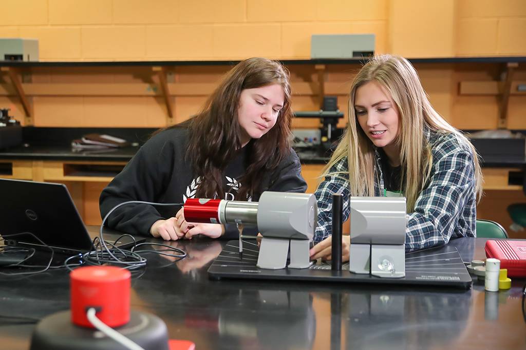 Katie Moller works on experiement with another student