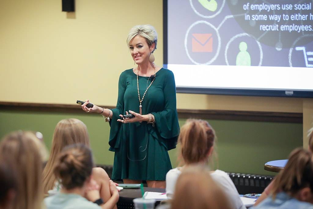 Kayla Delzer speaking at UND event