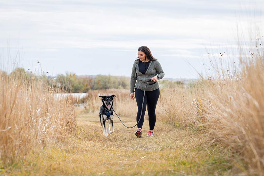 mckenzie walking her dog in the fall