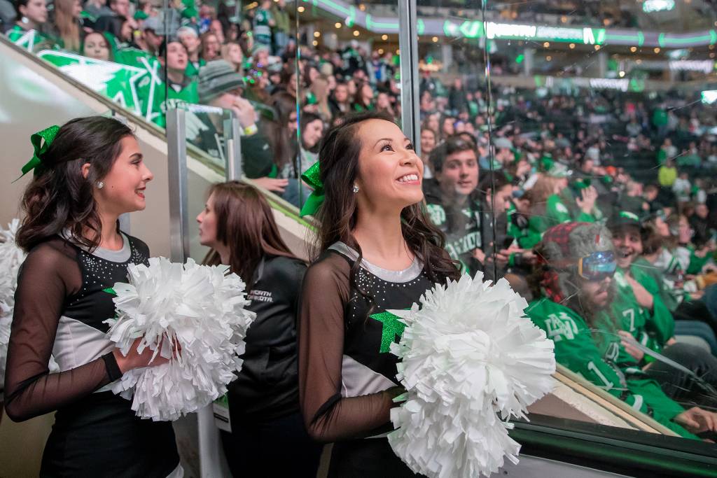 Michelle smiling at hockey game