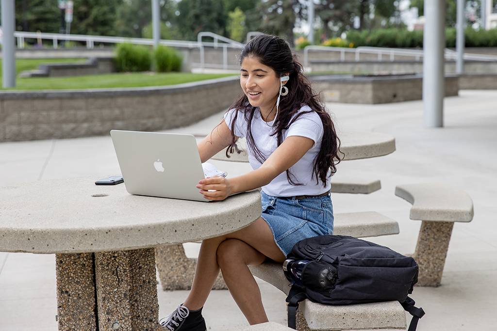 Ranju Dhungana works on a laptop