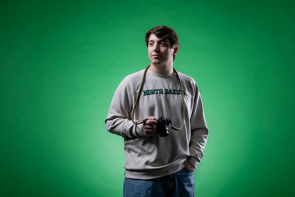 tucker wearing a UND sweatshirt
