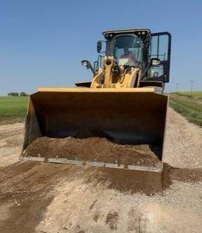 bobcat pushing dirt