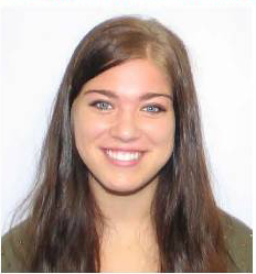 Color photo of woman's smiling face, from the shoulders up, looking at camera, with white background, no props, no other people, and not outside.