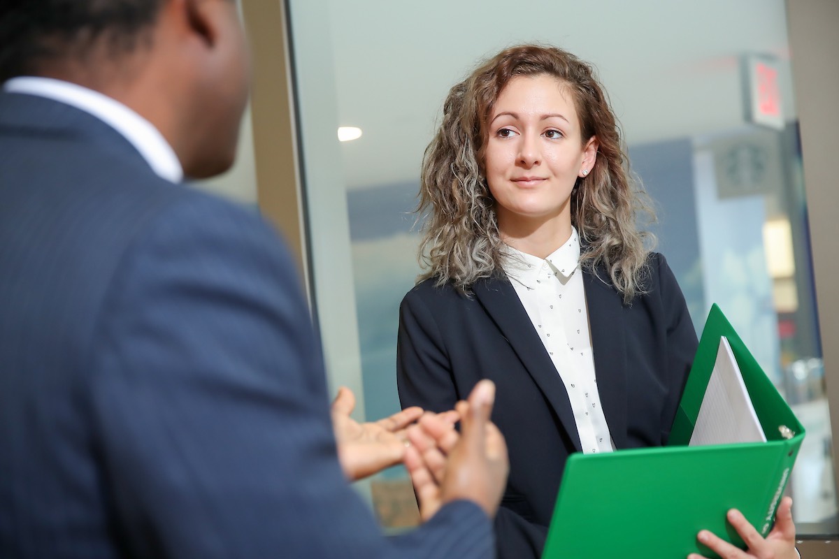 Grad student talking to professor