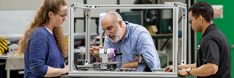 aerospace engineering masters students in lab