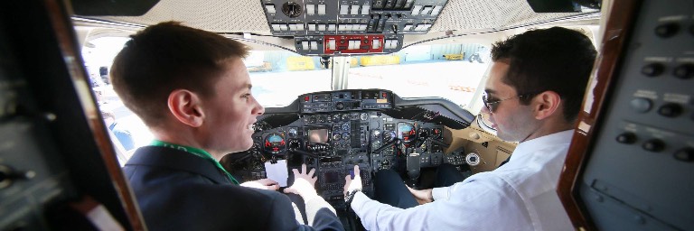 Aviation management student pilots in cockpit
