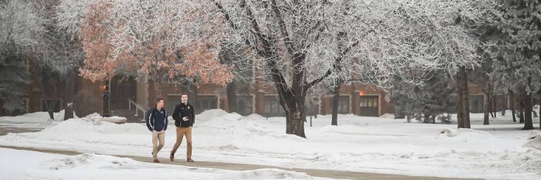 classical studies students walking on snowy campus